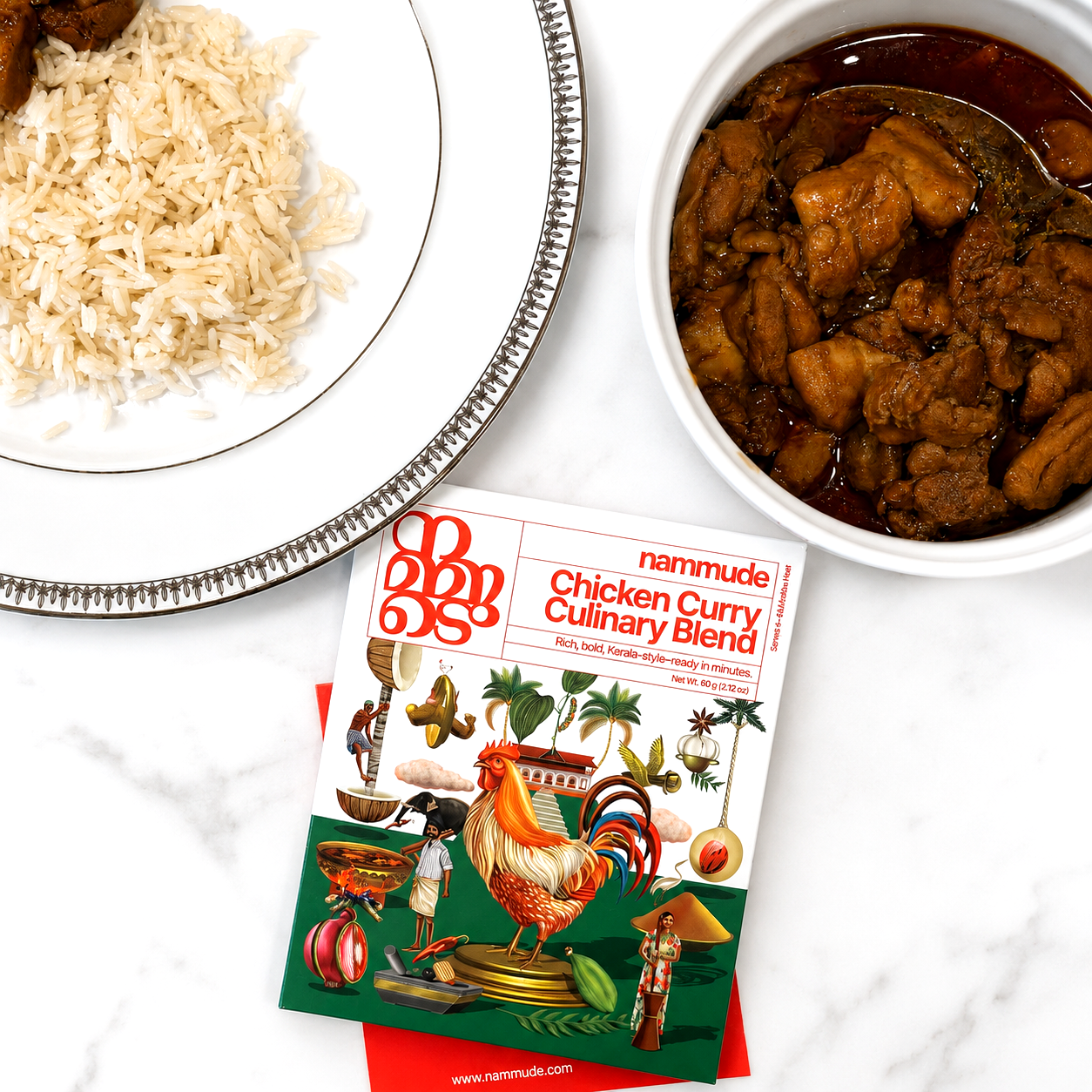 Nammude Chicken Curry Culinary Blend box beside a bowl of Kerala-style chicken curry and basmati rice